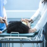 Child receiving urgent medical attention on hospital gurney