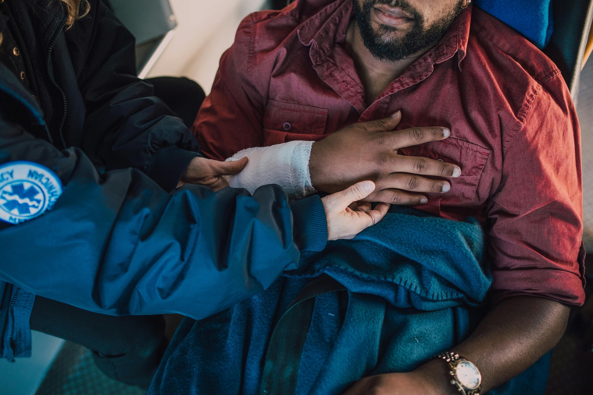 medical worker helping injured man