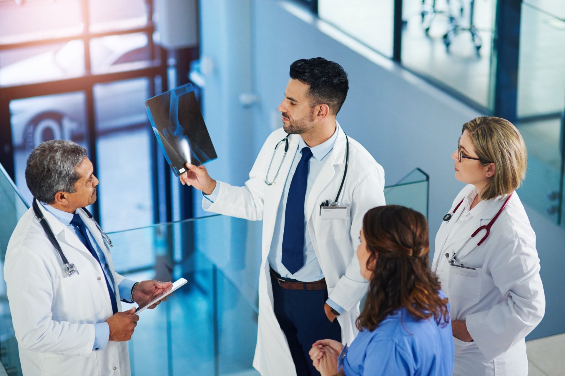 Medical team examining an x-ray in a hospital setting