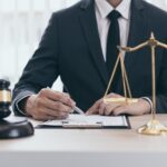 lawyer signing document